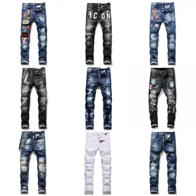 Nine pairs of distressed and patchwork denim jeans photographed flat