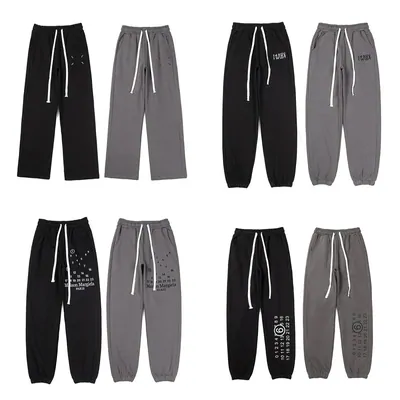 Drawstring joggers in black and grey with small embroidered logos